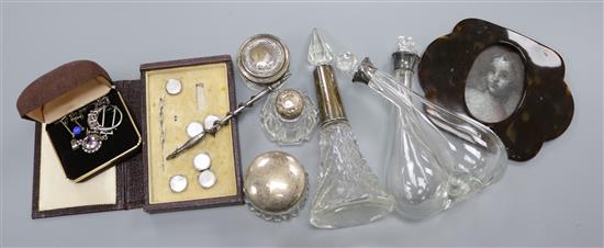 Mixed silver topped bottles and jewellery.